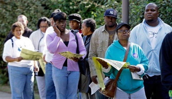Voters stand in line at an early voting site in Charlotte, North Carolina, in October 2008.
