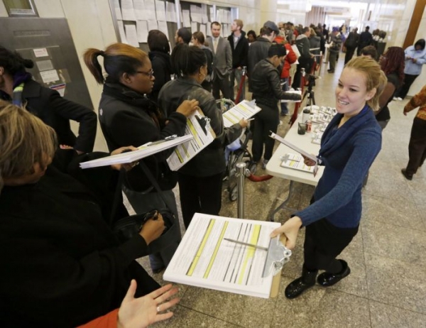 Voters line-up to register and cast their early votes at the City-County Building Monday, Nov. 5, 2012, in Indianapolis. 