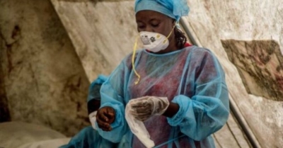 Health workers in an Ebola screening unit in Kenema government hospital, Sierra Leone. Health systems are not just a means for the technical delivery of goods and services; they are part of the core social fabric of societies.