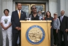 Alameda County Chief Probation Officer LaDonna M. Harris speaks as California Secretary of State Alex Padilla, second from left, looks on during a news conference at the Rene C. Davidson Courthouse in Oakland on Aug. 4, 2015. 