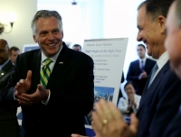 Virginia Gov. Terry McAuliffe,left, leads applause during an announcement at the State Capitol in Richmond Tuesday, Sept. 2, 2014, of a major gas pipeline through parts of Virginia, West Virginia and North Carolina. 