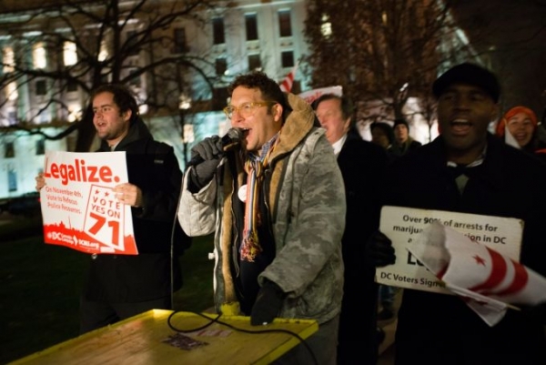 Adam Eidinger, center, chairman of the DC Cannabis Campaign, and other protesters march through Washington, demanding that Congress remove an appropriations rider that would overturn a popular ballot initiative legalizingmarijuana. 