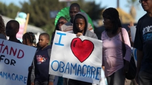 Supporters of the Affordable Care Act march in the 29th annual Kingdom Day Parade on Jan. 20, 2014, in Los Angeles.  