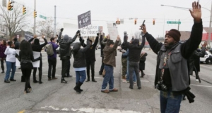 Demonstrators block Calumet Avenue at Highland Street for a short period Sunday during a Black Lives Matter demonstration at the Hammond City Hall.